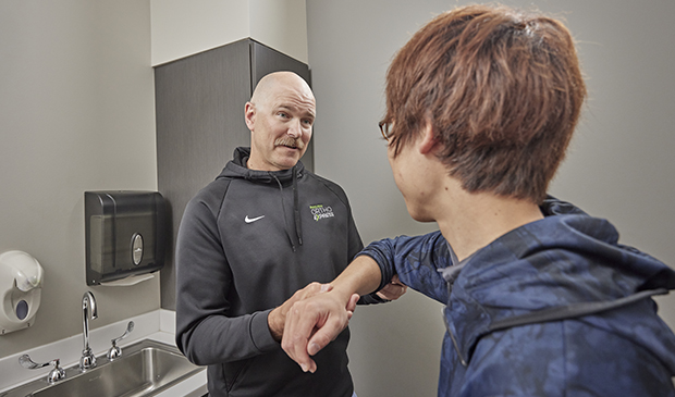 Physician evaluating patient