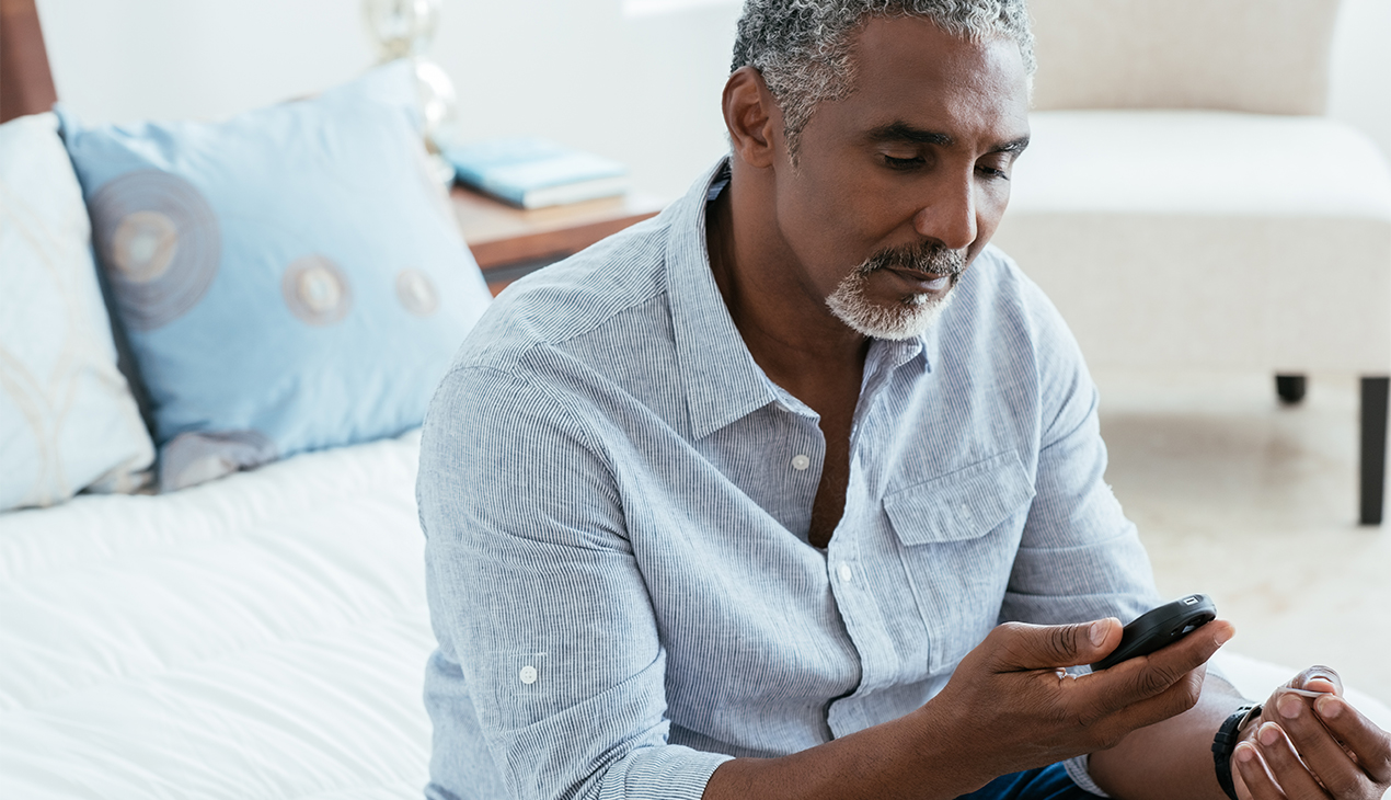 Man checking blood sugar