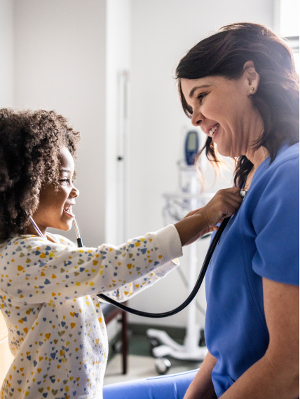 Child and provider smiling at each other